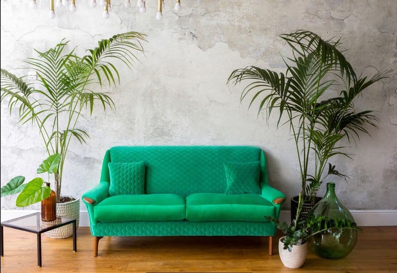 Upholstered vintage sofa in emerald green velvet Kirkby Design fabric