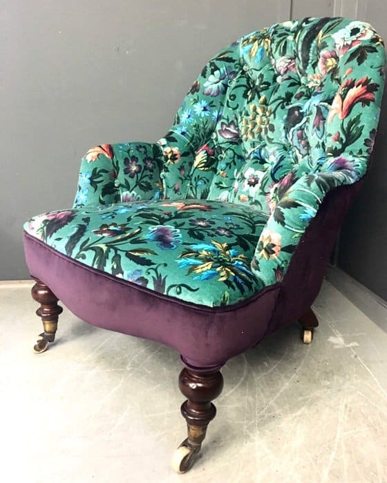 Upholstered antique armchair in purple and green flowering velvet House Of Hackney fabric