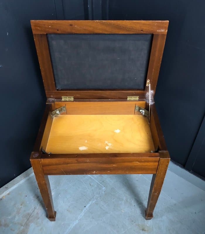 Old vintage piano stool with hidden compartment
