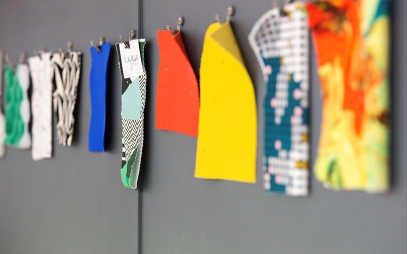 Upholstery fabric pinned to studio wall