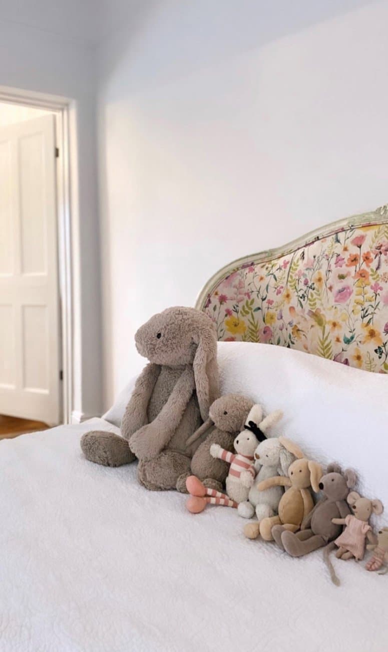 Reupholstered 1920's bed in Studio G Lolita Summer linen with teddy's on top
