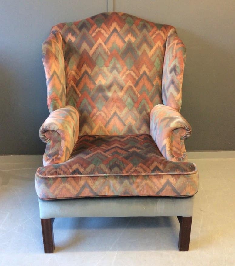 Old wing back chair in need of reupholstering
