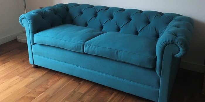 Reupholstered repro Chesterfield sofa