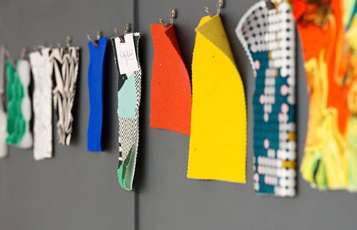 Upholstery fabric pinned to studio wall