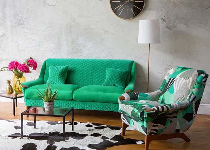 Green sofa and patterned armchair