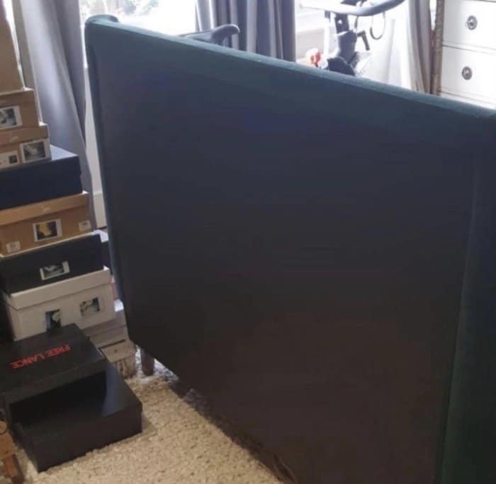 Dark blue headboard in need of reupholstering
