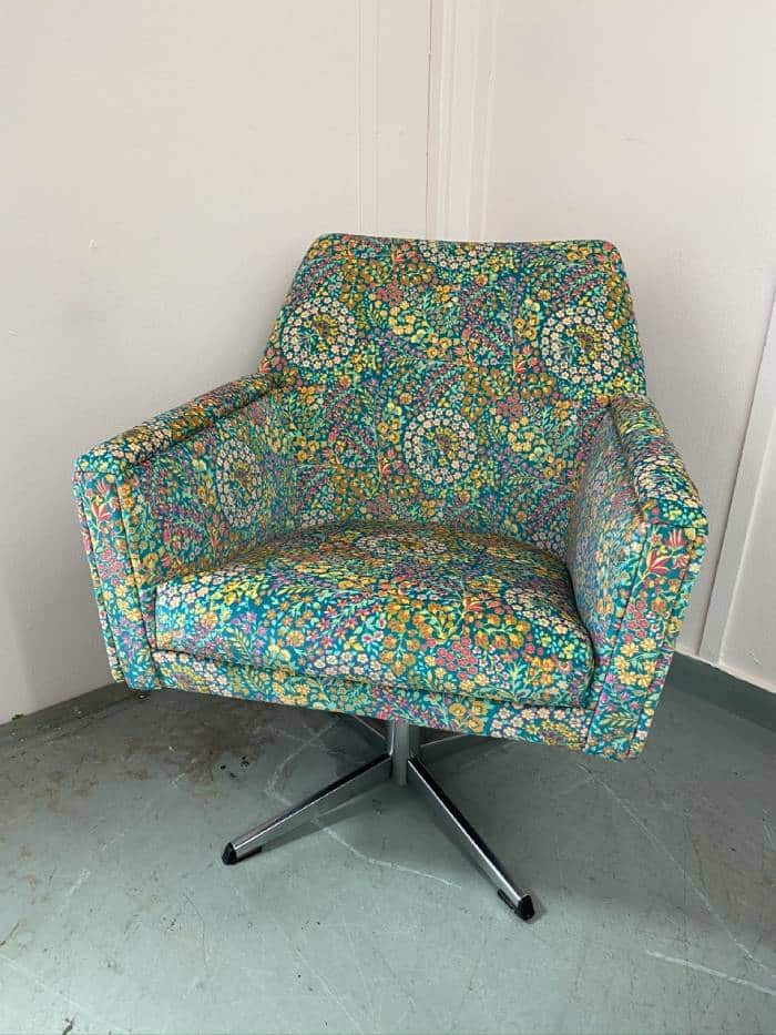 Floral patterned reupholstered armchair