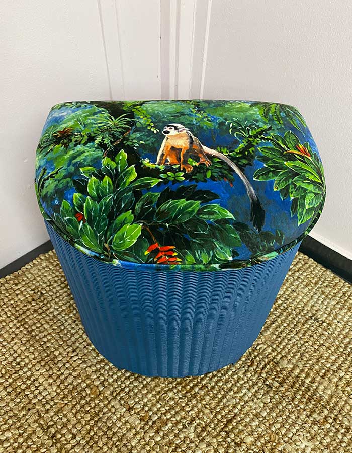 Upholstered blue Lloyd Loom Ottoman with patterned fabric