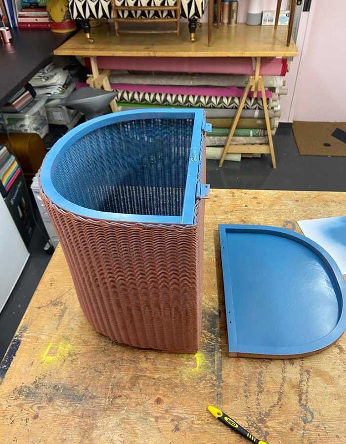Inside and lid of Lloyd Loom Ottoman painted blue