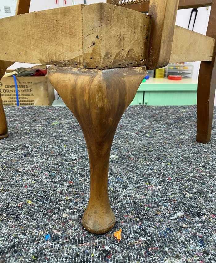 Old wooden chair without fabric in need of reupholstering