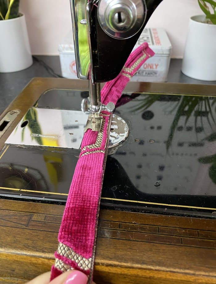 Upholstery fabric being used with sewing machine for single piping