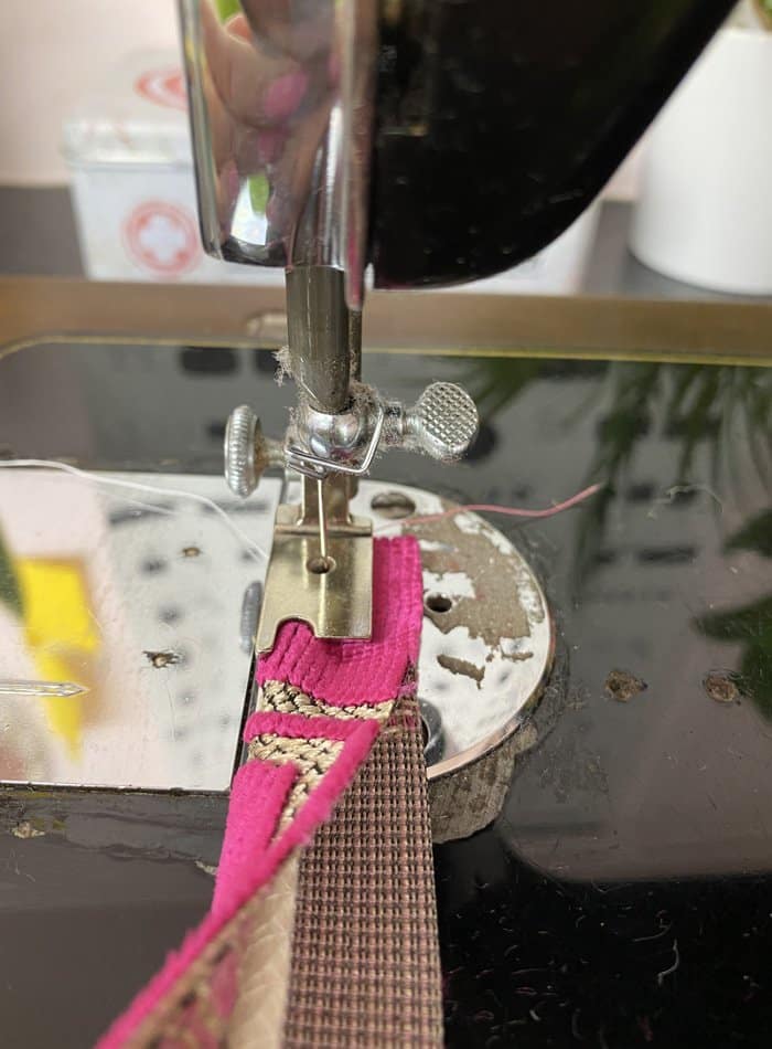 Upholstery fabric being used with sewing machine for single piping