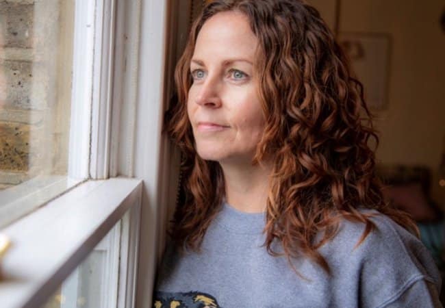 Sharon O'Connor looking out the window