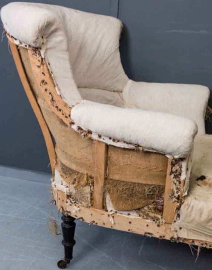 Arm chair ready for reupholstery using upholstery supplies and sundries