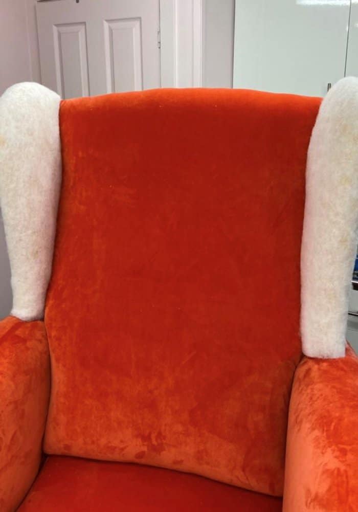 adding new fabric to the seat, back and the inside wings when a reupholstering chair