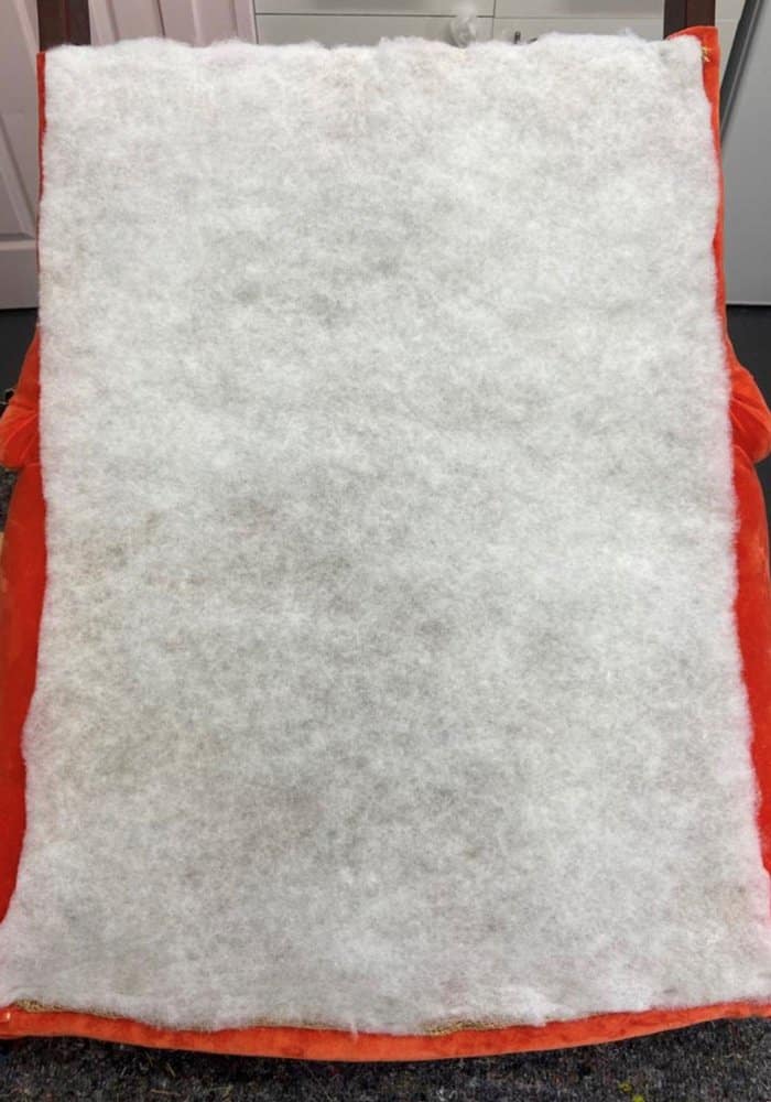 adding polyester and fabric to the back when reupholstering a chair