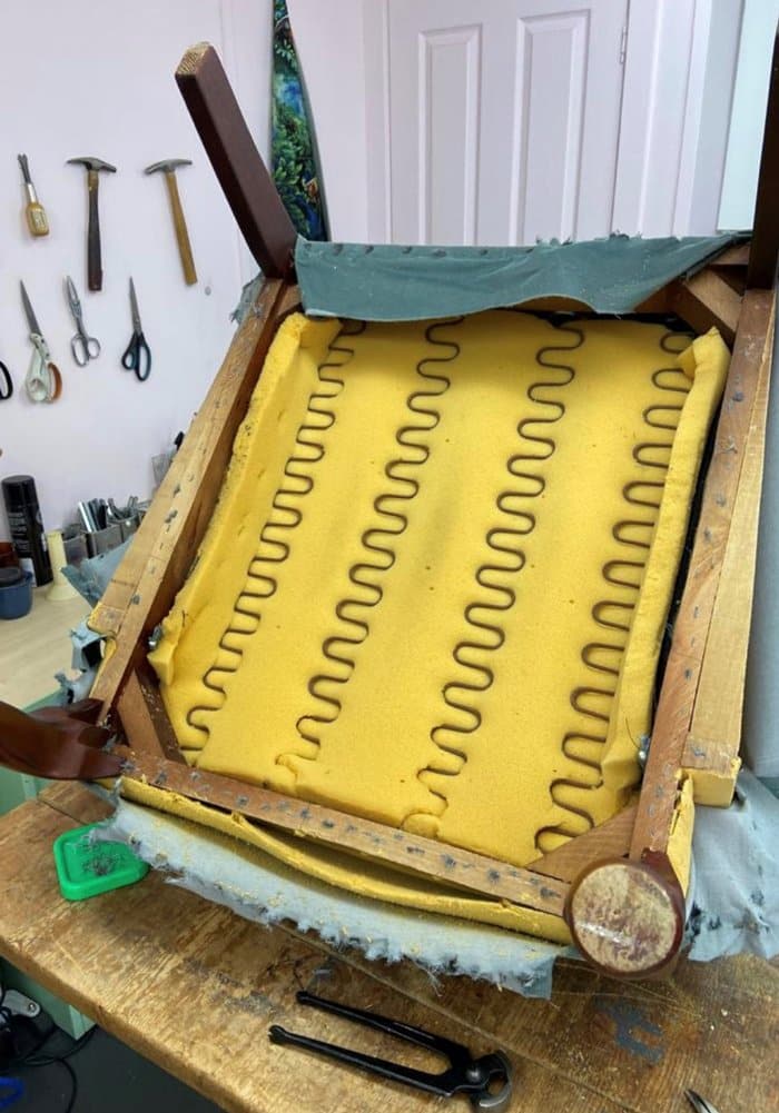 spring base and foam at the base of a chair being reupholstered