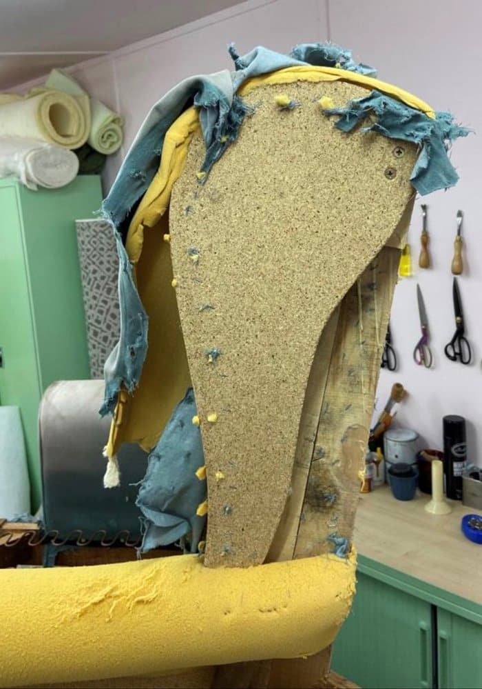 a detailed look of the wings when reupholstering a chair