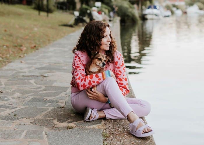 Vintique Upholstery personal branding photoshoot: Sharon O'Connor sat by a lake with her dog