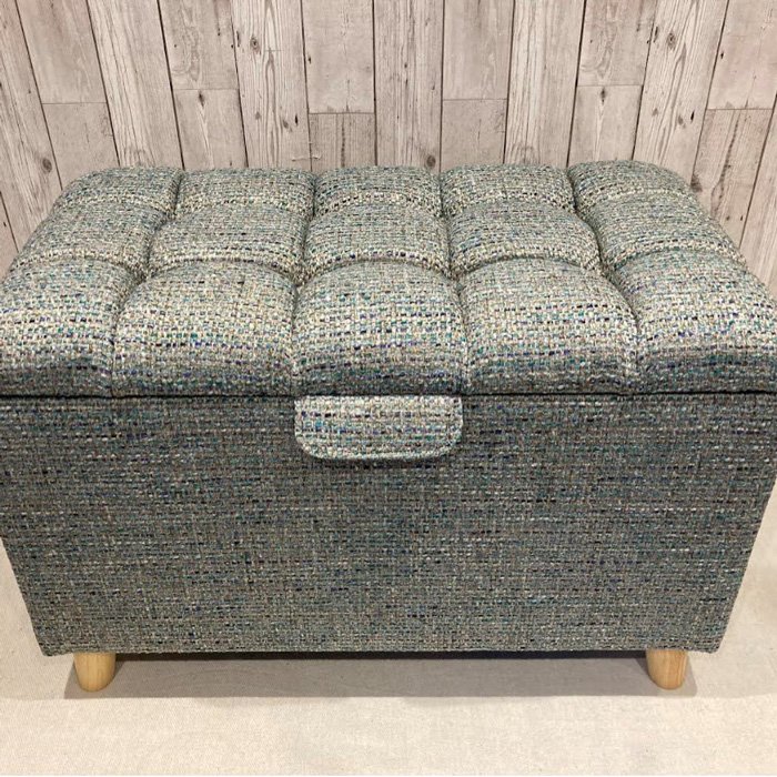 a closed upholstered ottoman
