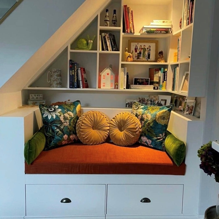 renovated reading nook area with upholstered cushions and bench
