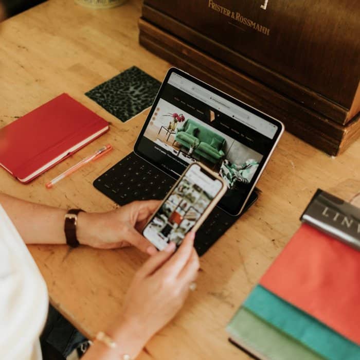Vintique Upholstery's social media and website on mobile & laptop