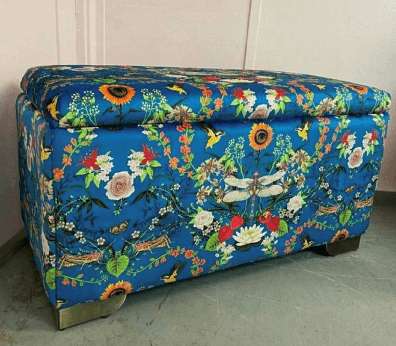 Side on view of finished ottoman in Becca Who Garden Treasures print fabric