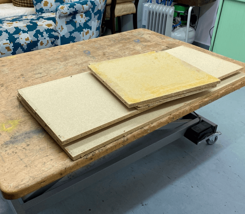 Replacement panels lay on a work bench in the Vintique upholstery workshop