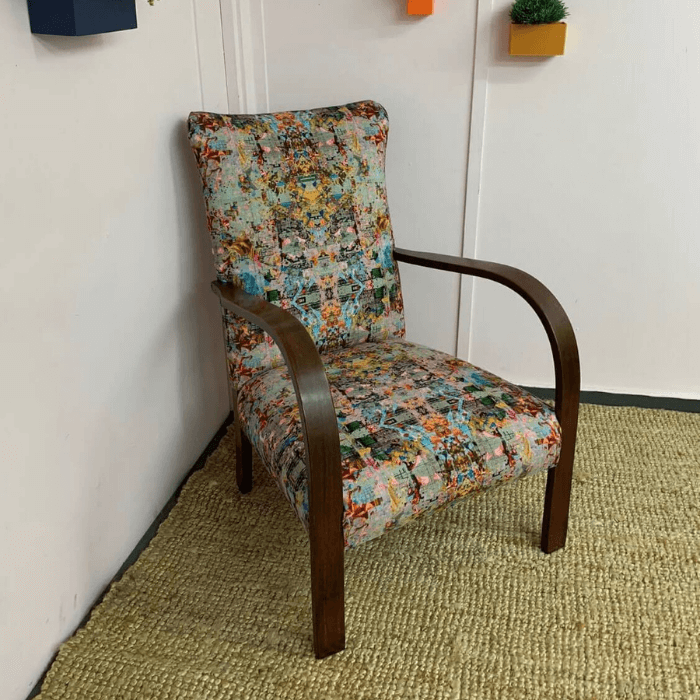 The Neo chair in Black Pop velvet fabric that is made from recycled water bottles.