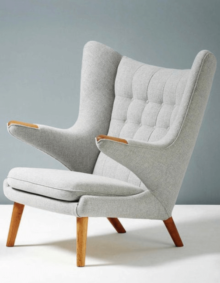 A Papa Bear statement chair in light grey fabric