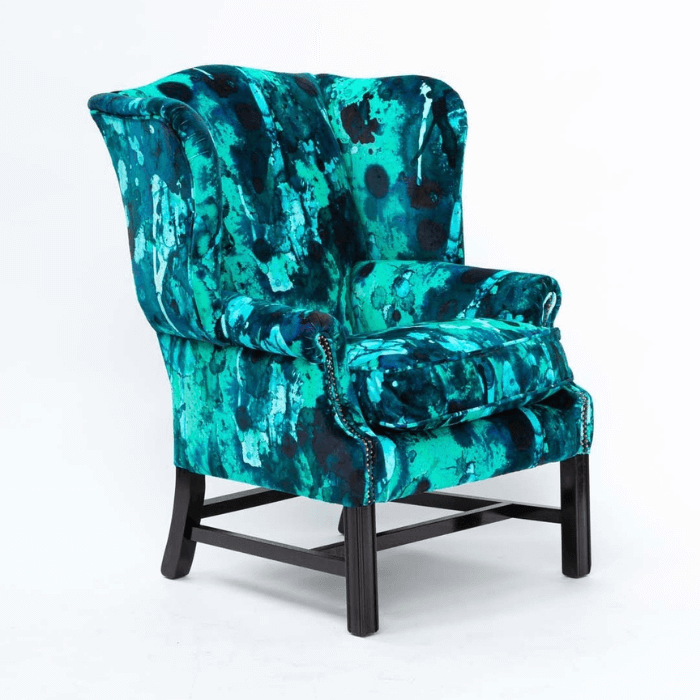 Wing chair in Storm Blotch Velvet fabric combining sky blue and indigo