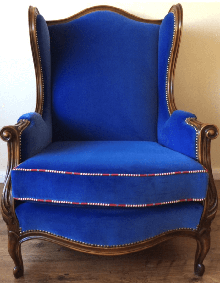 Antique French wing chair in Linwood omega blue velvet