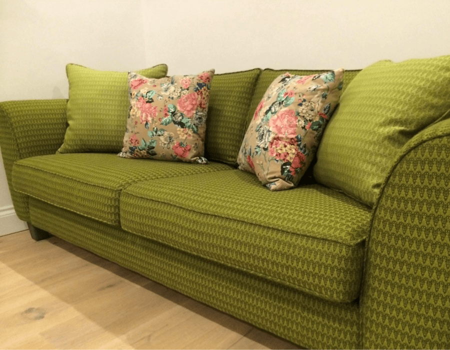 Green Heals sofa in Bute wool Ramshead fabric with floral scatter cushions