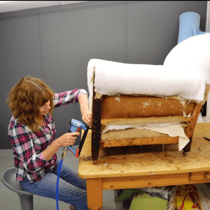 Sharon O'Connor reupholstering a chair