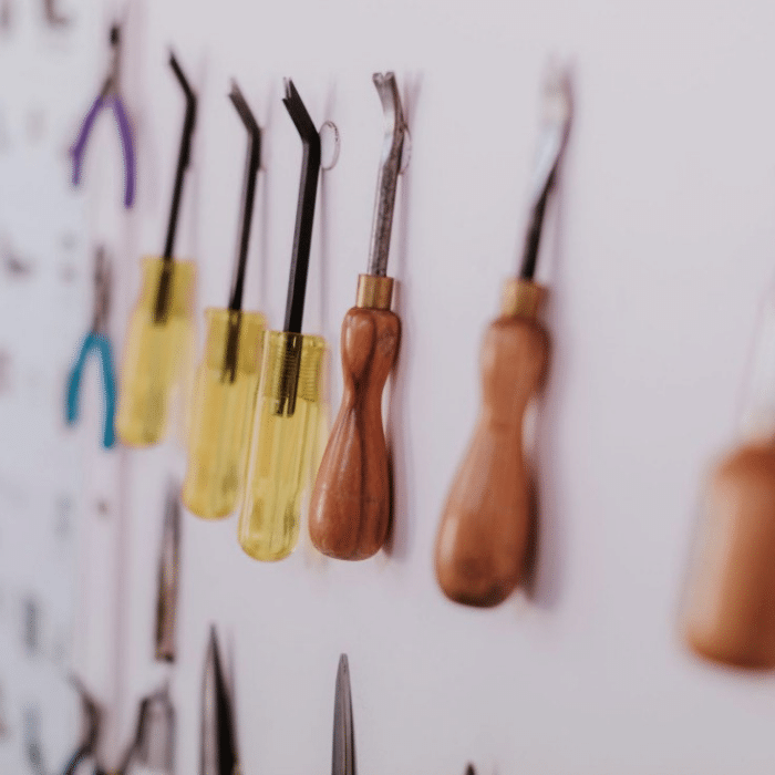 Upholstery tools line the wall of the Vintique Upholstery workshop