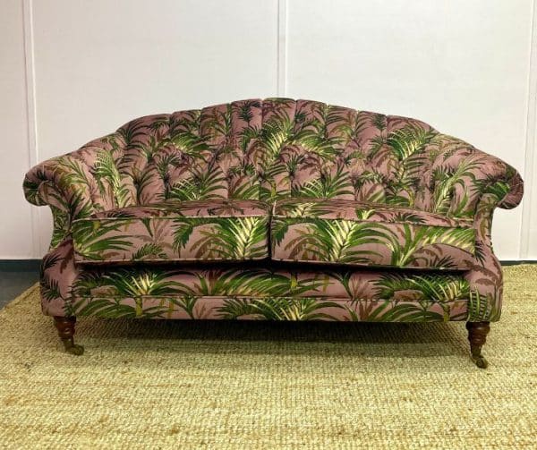 Antique sofa reupholstered in a palm leaf print