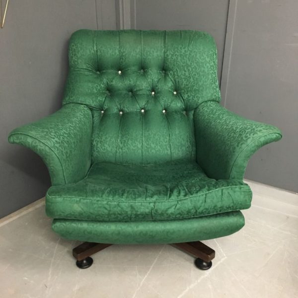 Green button backed swivel chair awaiting reupholstery