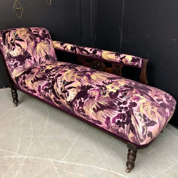Chaise longue after reupholstery with a purple patterned fabric