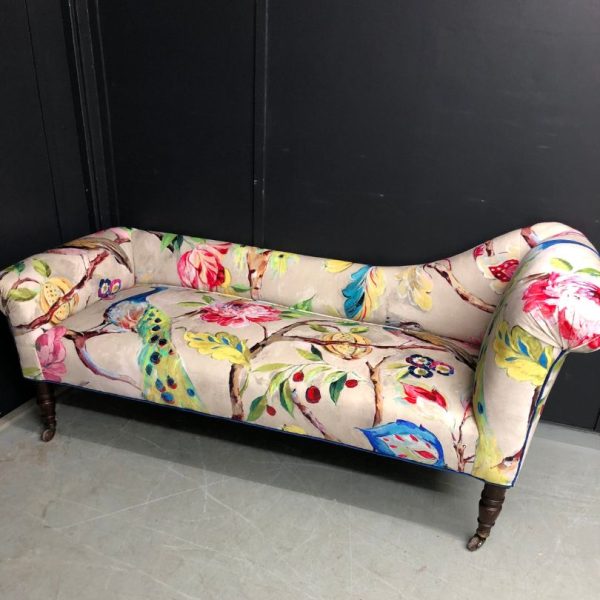Chaise longue reupholstered in a bold, bright, fabric