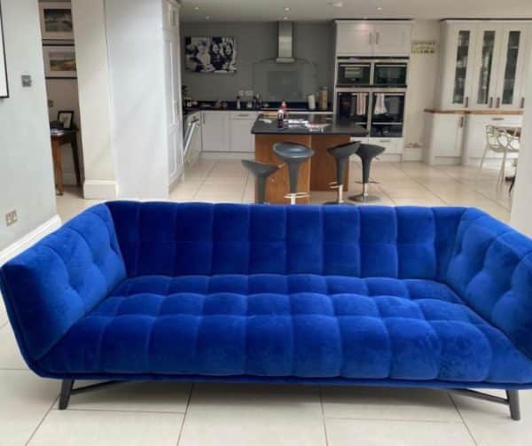 Cobalt blue button backed reupholstered sofa