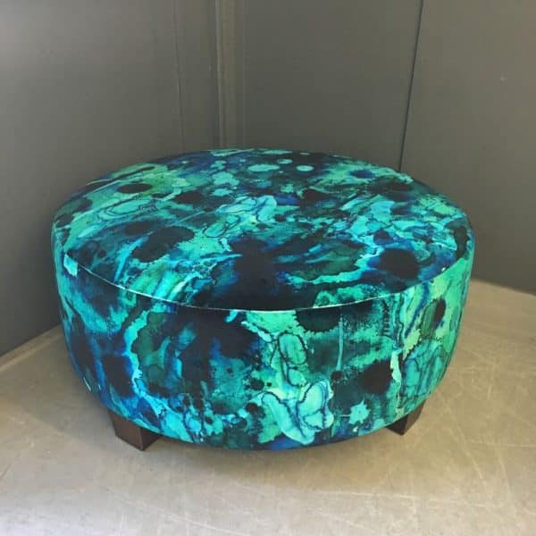 Footstool reupholstered in blue and green watercolour velvet fabric