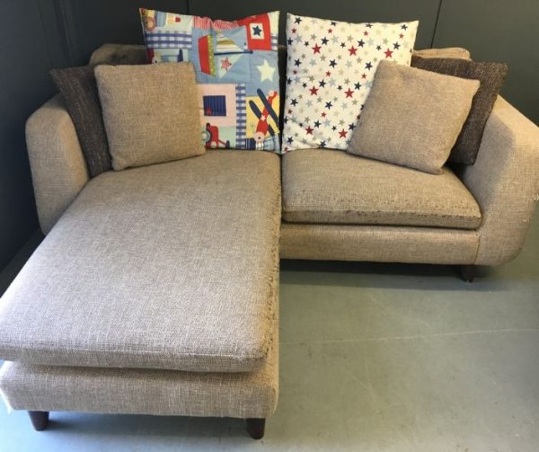 L shaped modern sofa in need of reupholstery