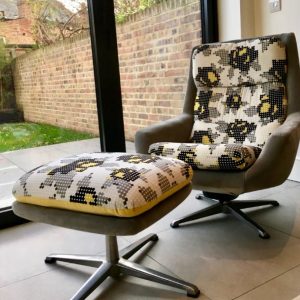 Mid century chair and footstool reupholstered in graphic print fabric