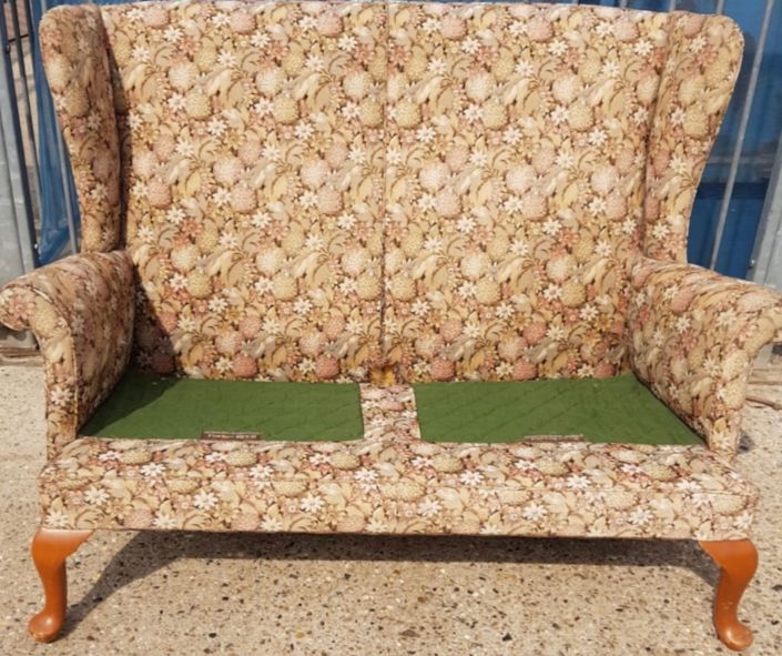 Mid-century high backed sofa in need of reupholstery without seat cushions
