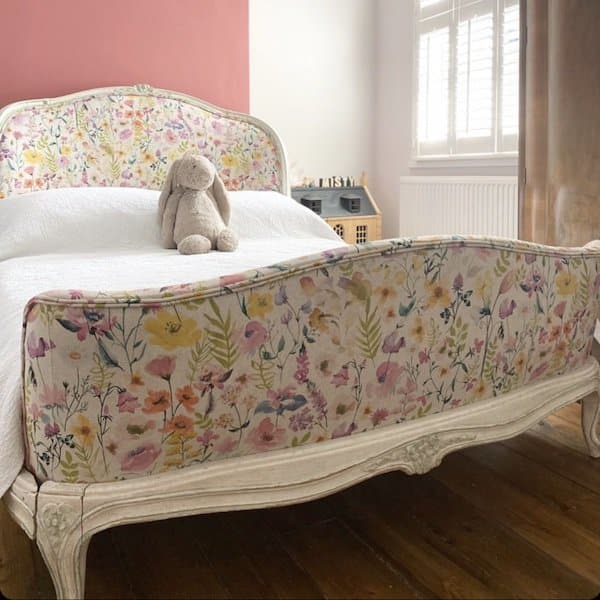 Reupholstered bed in a country floral fabric