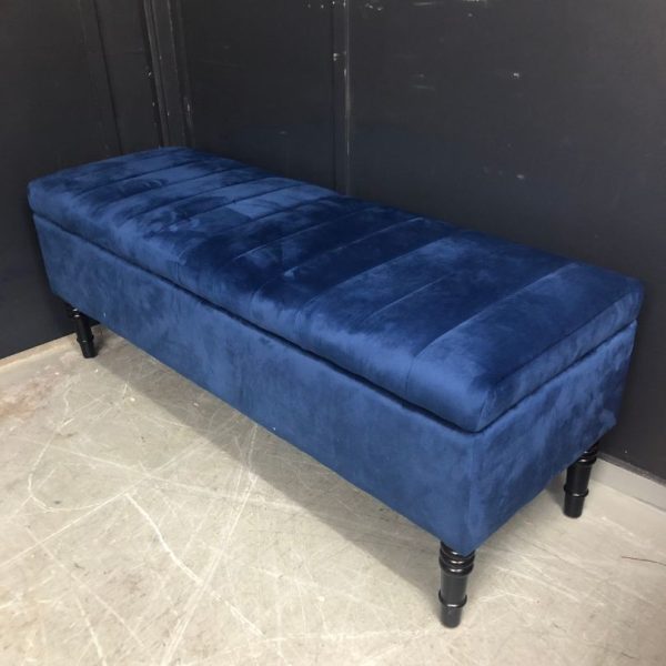 Reupholstered blue ottoman with dark legs