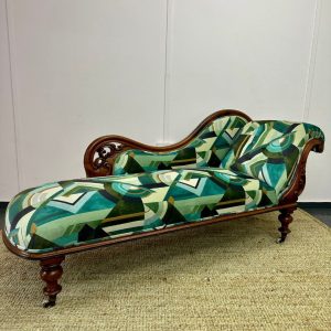 Reupholstered chaise longue in a green print