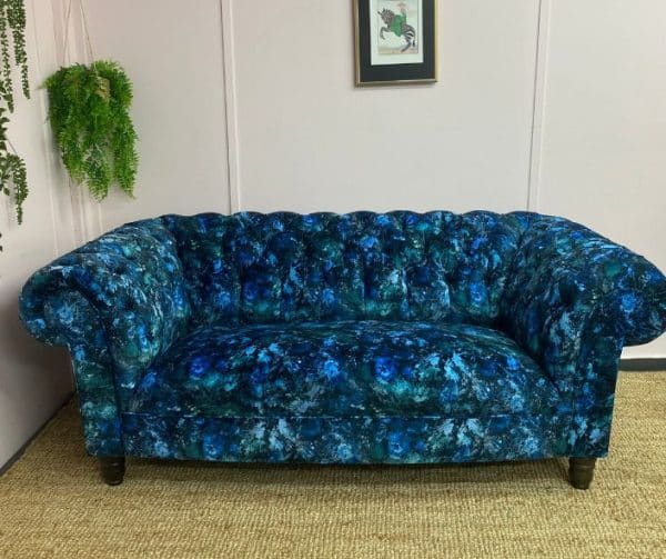 Reupholstered chesterfield sofa in a blue and green fabric