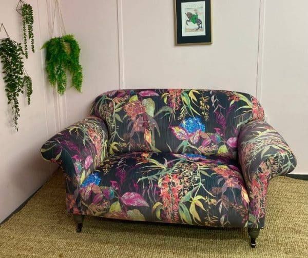 2 seater sofa reupholstered in a large floral print fabric