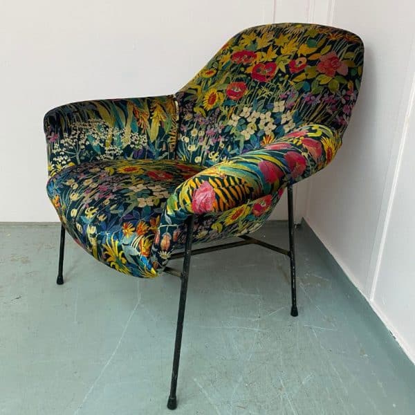 Metal framed chair after reupholstery with a luxury floral print fabric